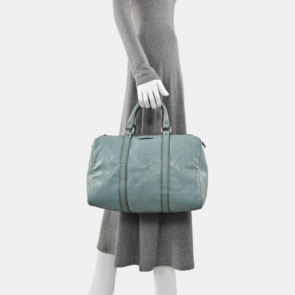 Authenticated pre-owned  Joy Medium Monogram Coated Canvas Blue - Top Handle Bag at Looply
