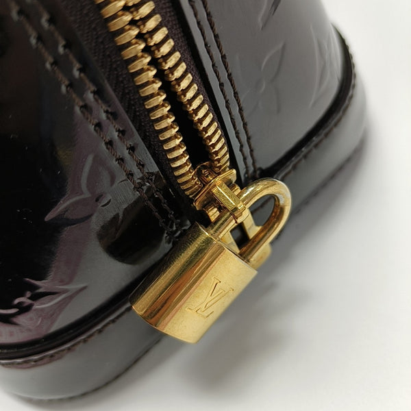 Authenticated pre-owned  Alma PM Monogram Patent Leather Brown - Top Handle Bag at Looply