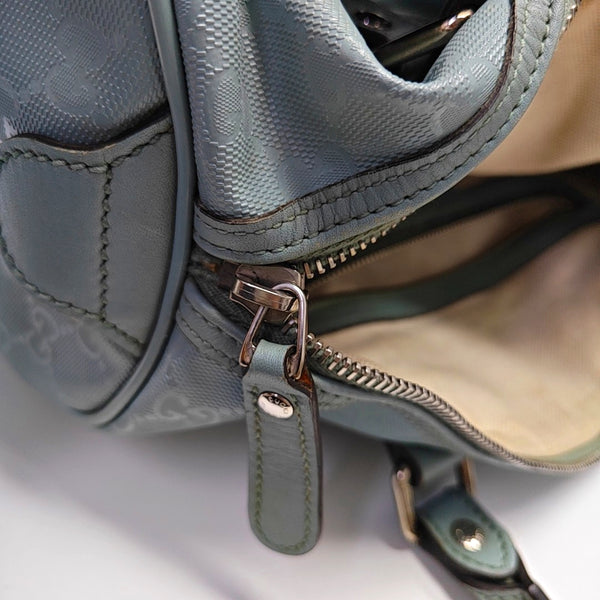 Authenticated pre-owned  Joy Medium Monogram Coated Canvas Blue - Top Handle Bag at Looply