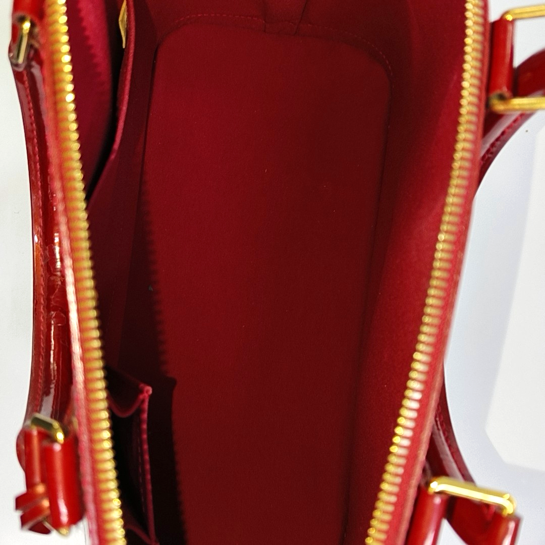 Authenticated pre-owned  Alma GM Patent Leather Red - Top Handle Bag at Looply