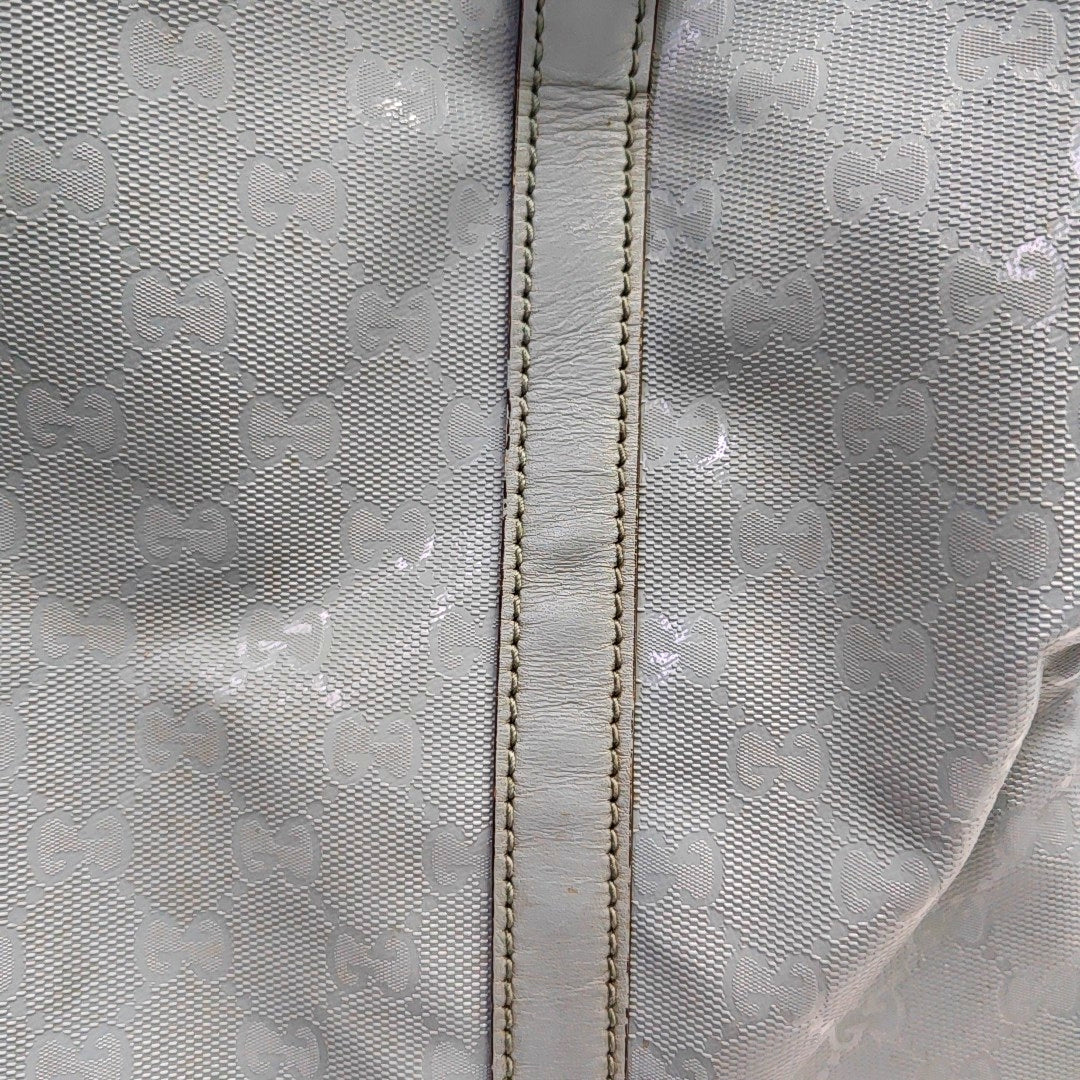 Authenticated pre-owned  Joy Medium Monogram Coated Canvas Blue - Top Handle Bag at Looply