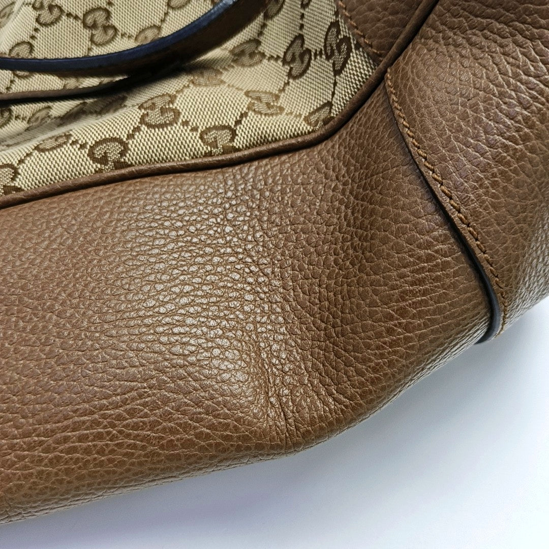 Authenticated pre-owned  Bree Small Monogram Canvas Beige - Top Handle Bag at Looply
