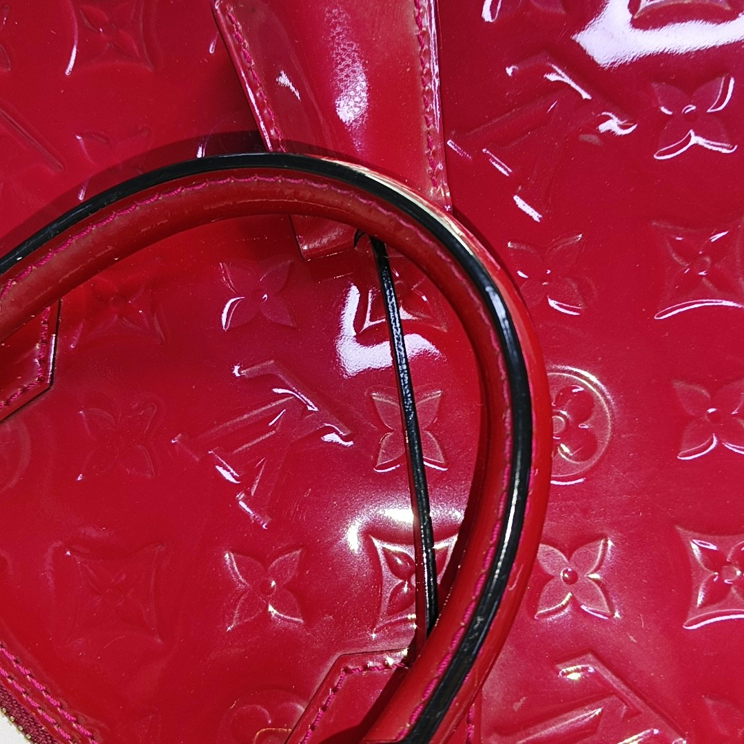 Authenticated pre-owned  Alma PM Monogram Calfskin Red - Top Handle Bag at Looply