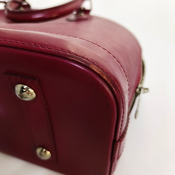 Authenticated pre-owned  Alma PM Epi Burgundy - Top Handle Bag at Looply