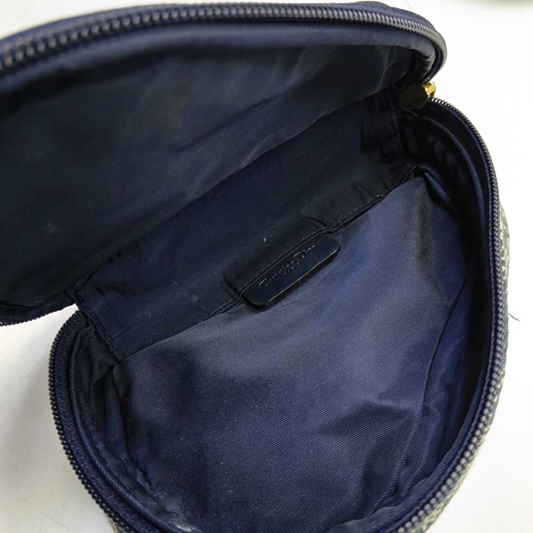 Authenticated pre-owned  Saddle Oblique Canvas Blue - Clutch at Looply