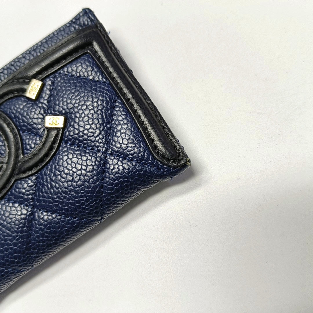 Authenticated pre-owned  Filigree Quilted Grained Calfskin Blue Card Holder - Card Holder at Looply