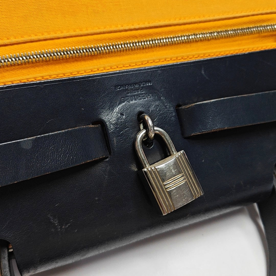 Authenticated pre-owned  Herbag 31 Canvas Yellow - Shoulder Bag at Looply