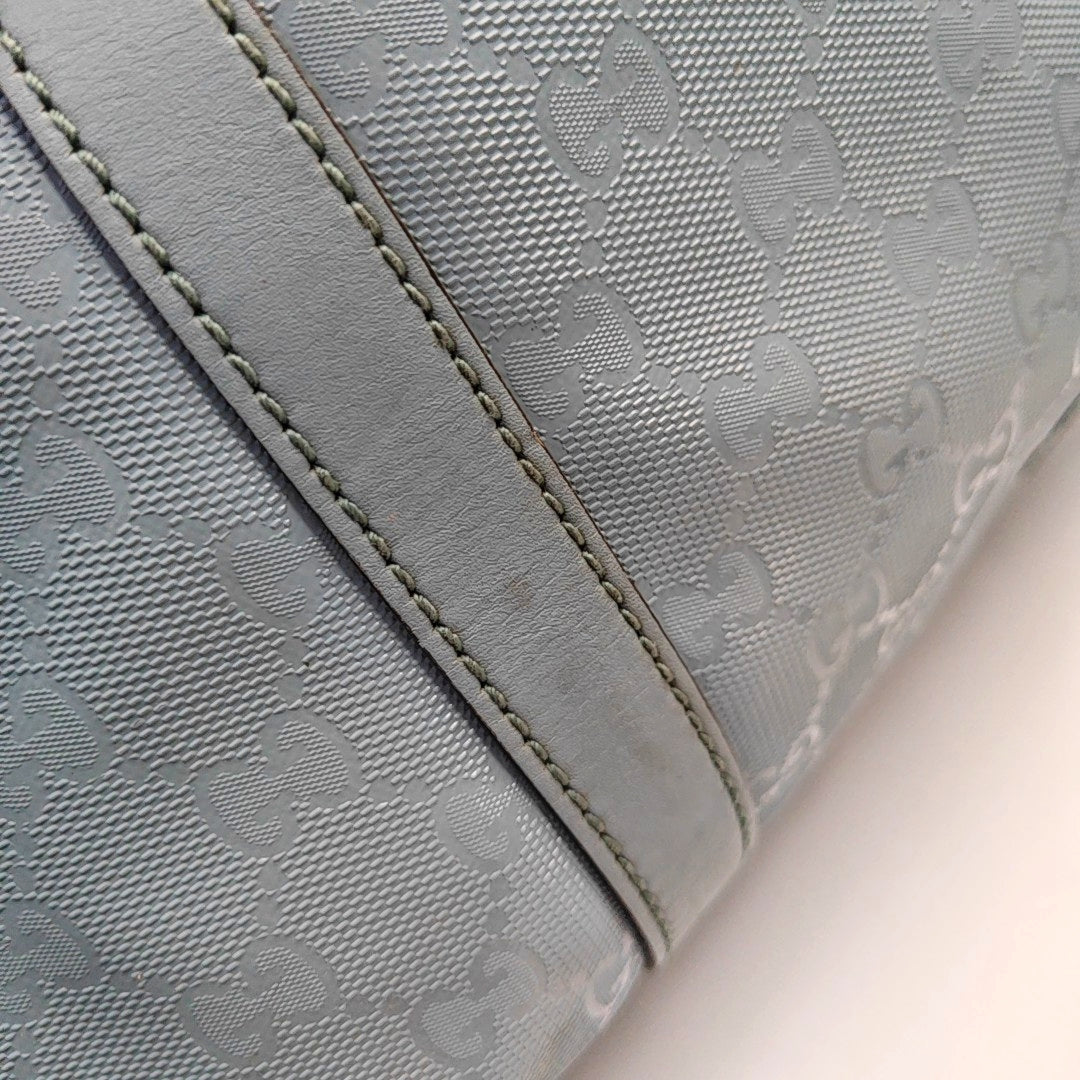 Authenticated pre-owned  Joy Medium Monogram Coated Canvas Blue - Top Handle Bag at Looply