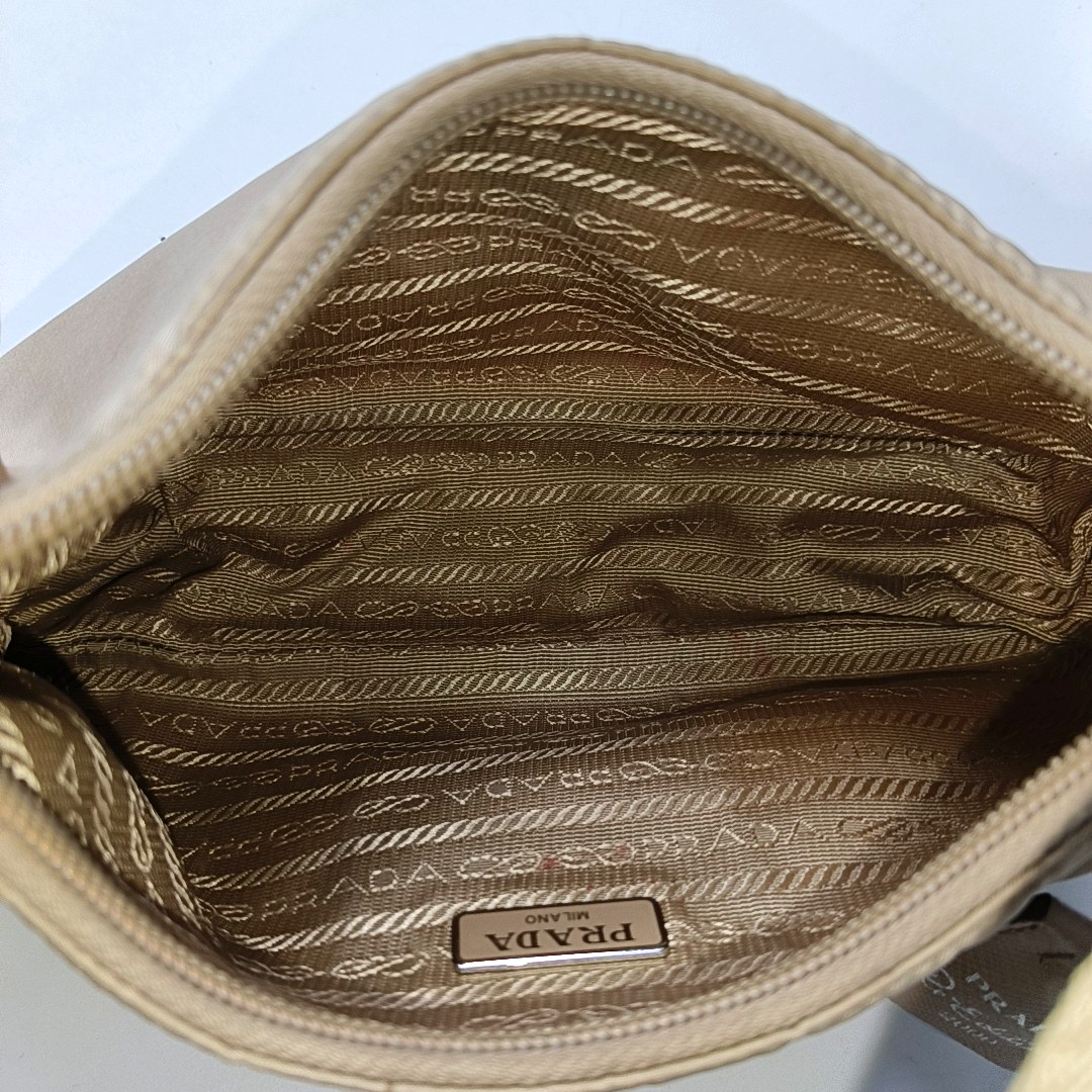 Authenticated pre-owned  Re-edition2000 Mini Nylon Beige - Top Handle Bag at Looply