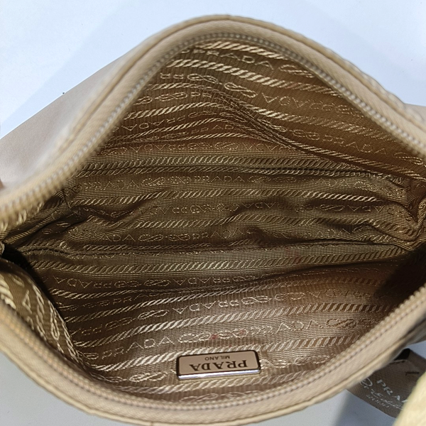 Authenticated pre-owned  Re-edition2000 Mini Nylon Beige - Top Handle Bag at Looply