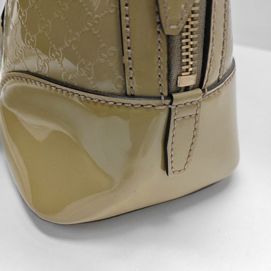 Authenticated pre-owned  Microguccissima Monogram Patent Leather Green - Top Handle Bag at Looply