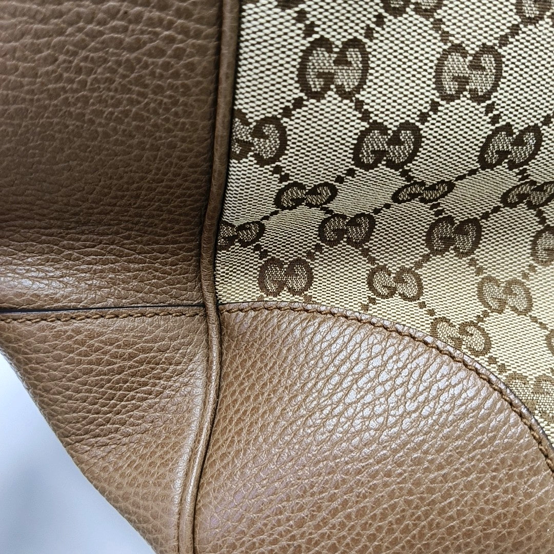 Authenticated pre-owned  Bree Small Monogram Canvas Beige - Top Handle Bag at Looply