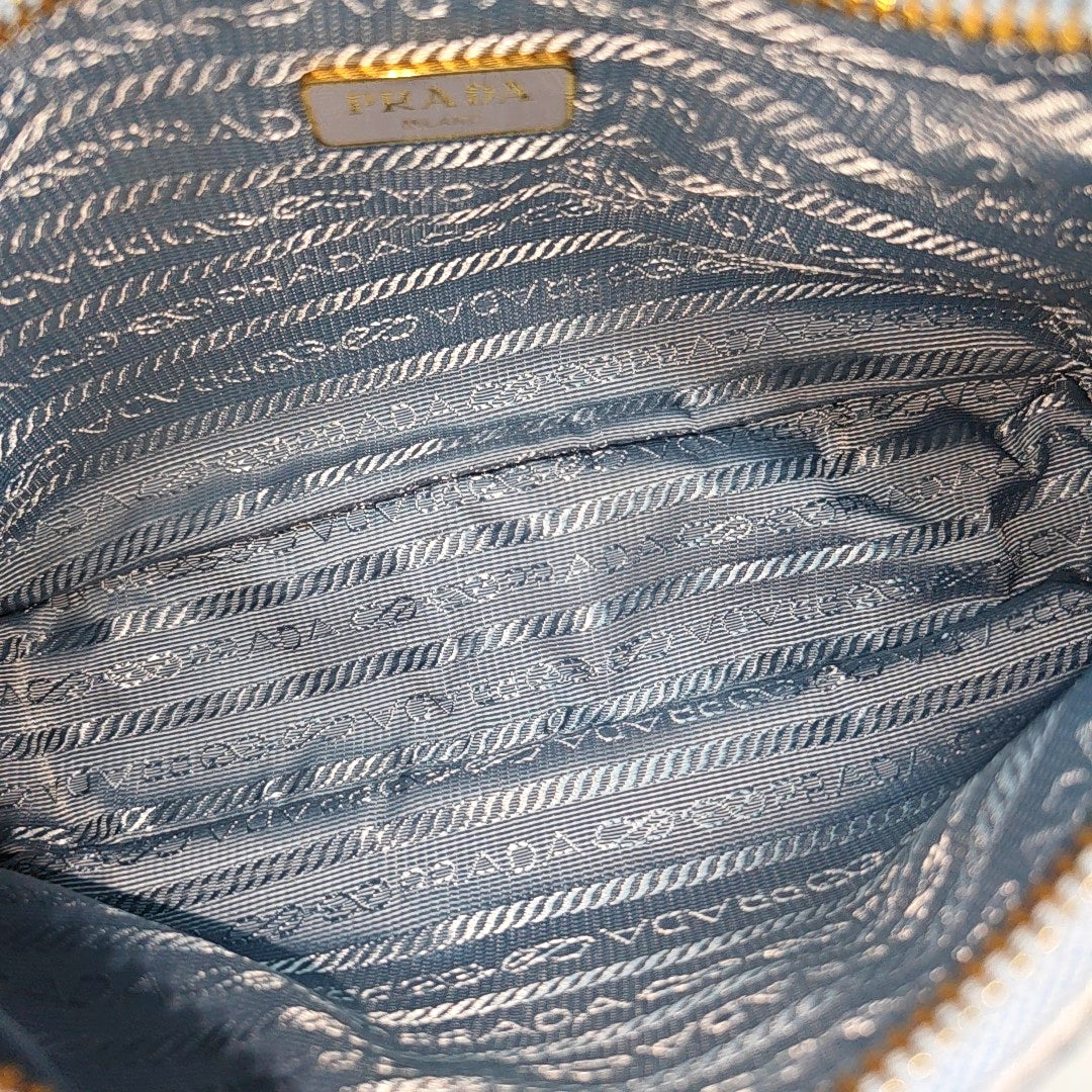 Authenticated pre-owned  Re-edition2005 Mini Nylon Blue - Top Handle Bag at Looply