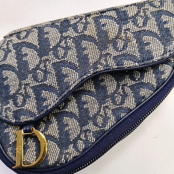 Authenticated pre-owned  Saddle Oblique Canvas Blue - Clutch at Looply