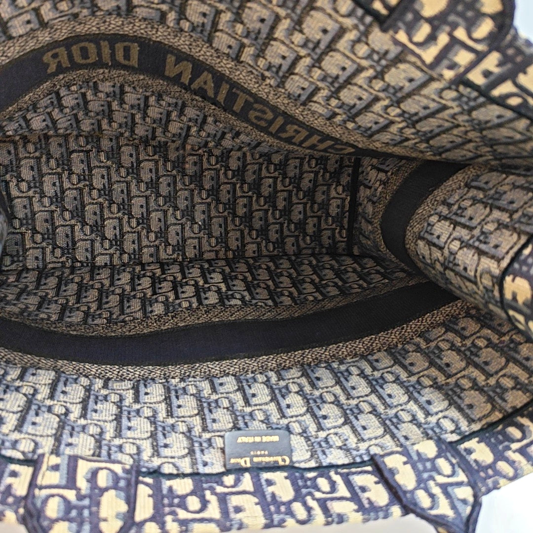 Authenticated pre-owned  Book Tote Large Monogram Canvas Blue - Top Handle Bag at Looply