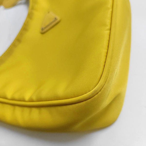 Authenticated pre-owned  Re-Edition2000 Mini Nylon Yellow - Top Handle Bag at Looply