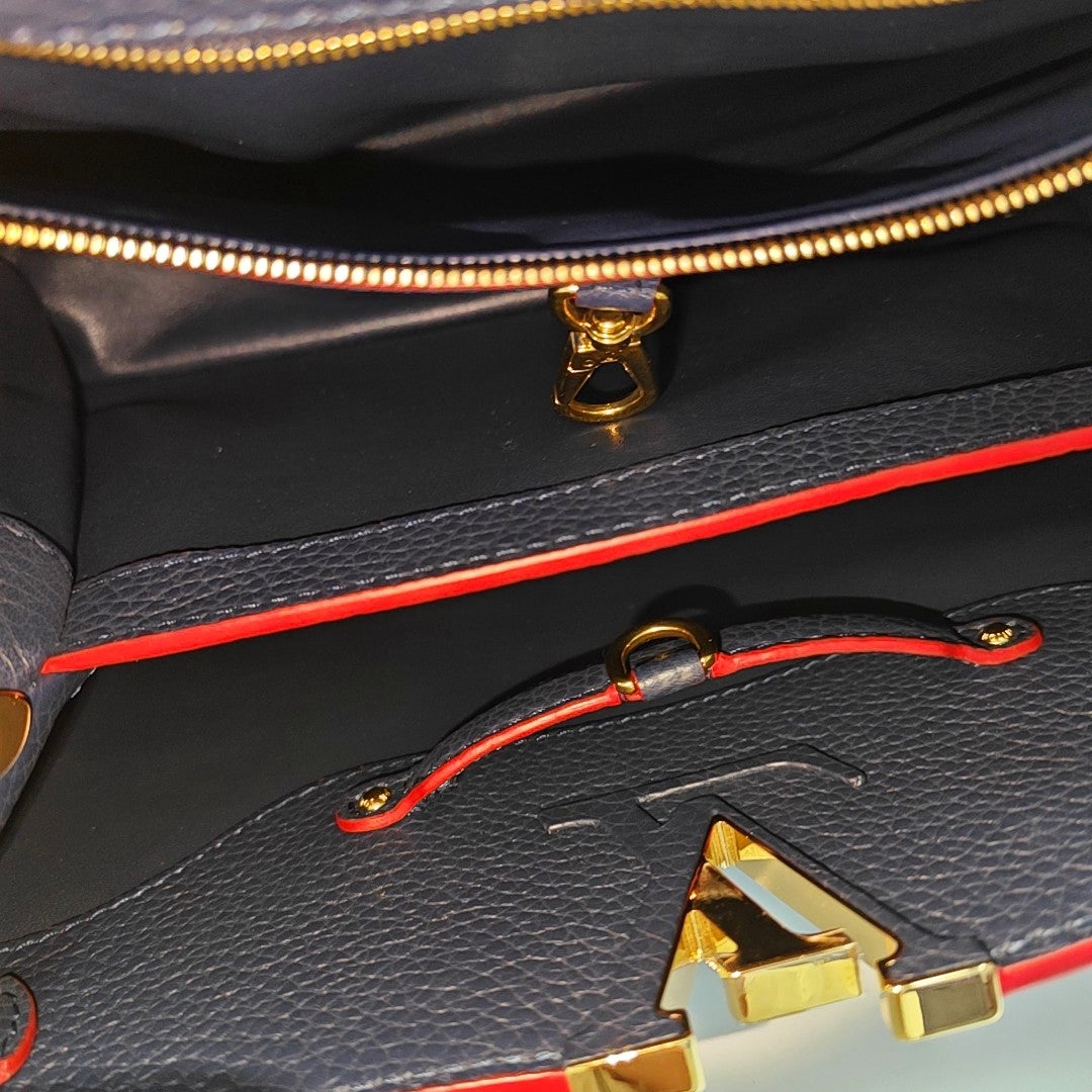 Authenticated pre-owned  Capucines MM Calfskin Blue - Shoulder Bag at Looply