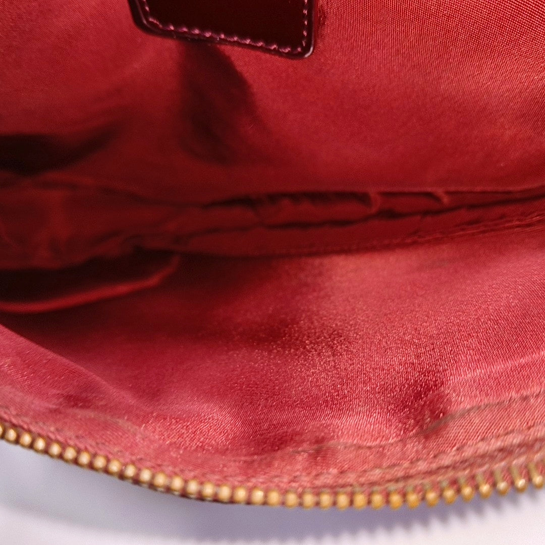 Authenticated pre-owned  Saddle Oblique Canvas Red - Top Handle Bag at Looply