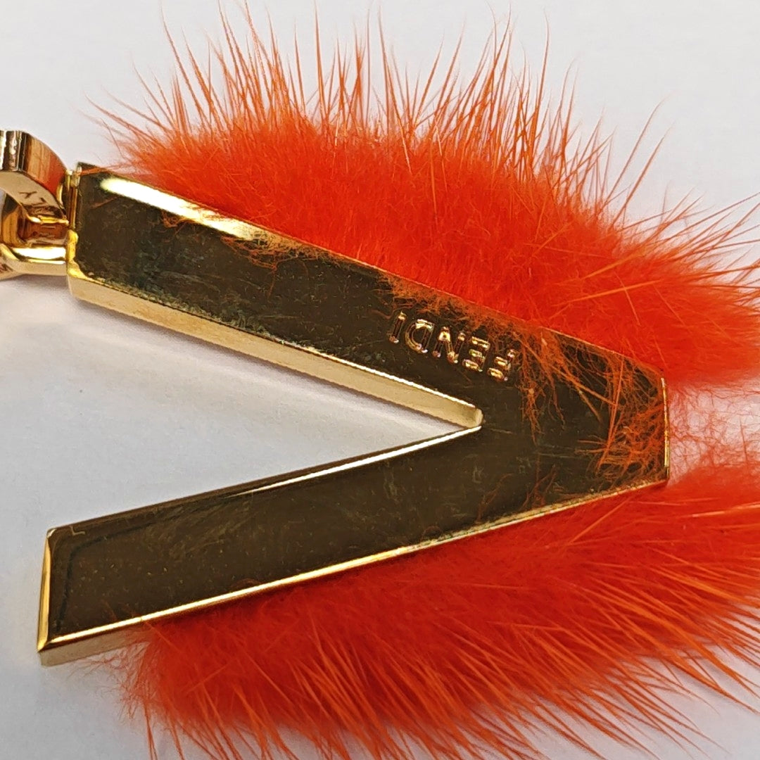 Authenticated pre-owned  Gold-tone Metal Bag Charm - Bag Charm at Looply