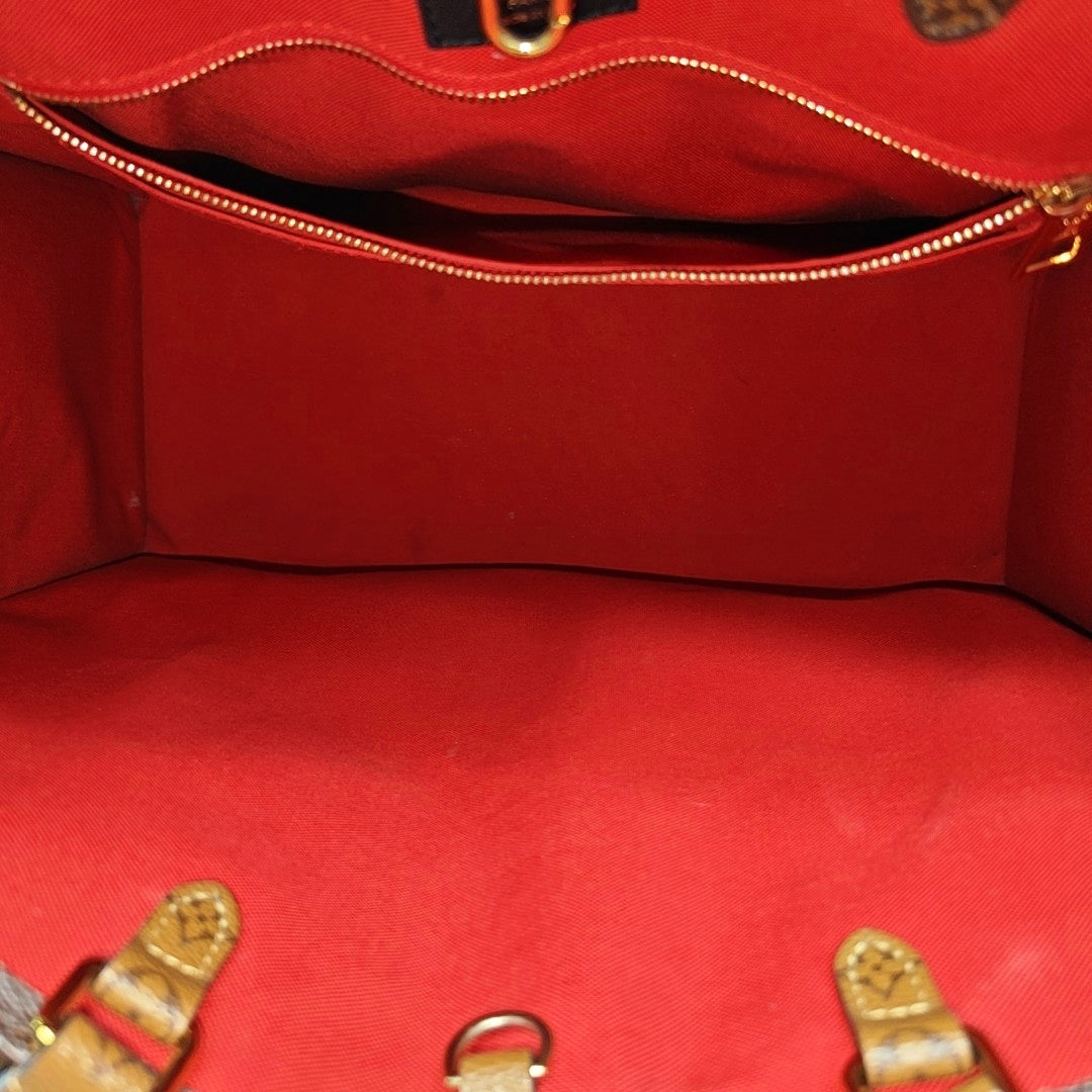 Authenticated pre-owned  Onthego GM Monogram Coated Canvas Brown - Shoulder Bag at Looply