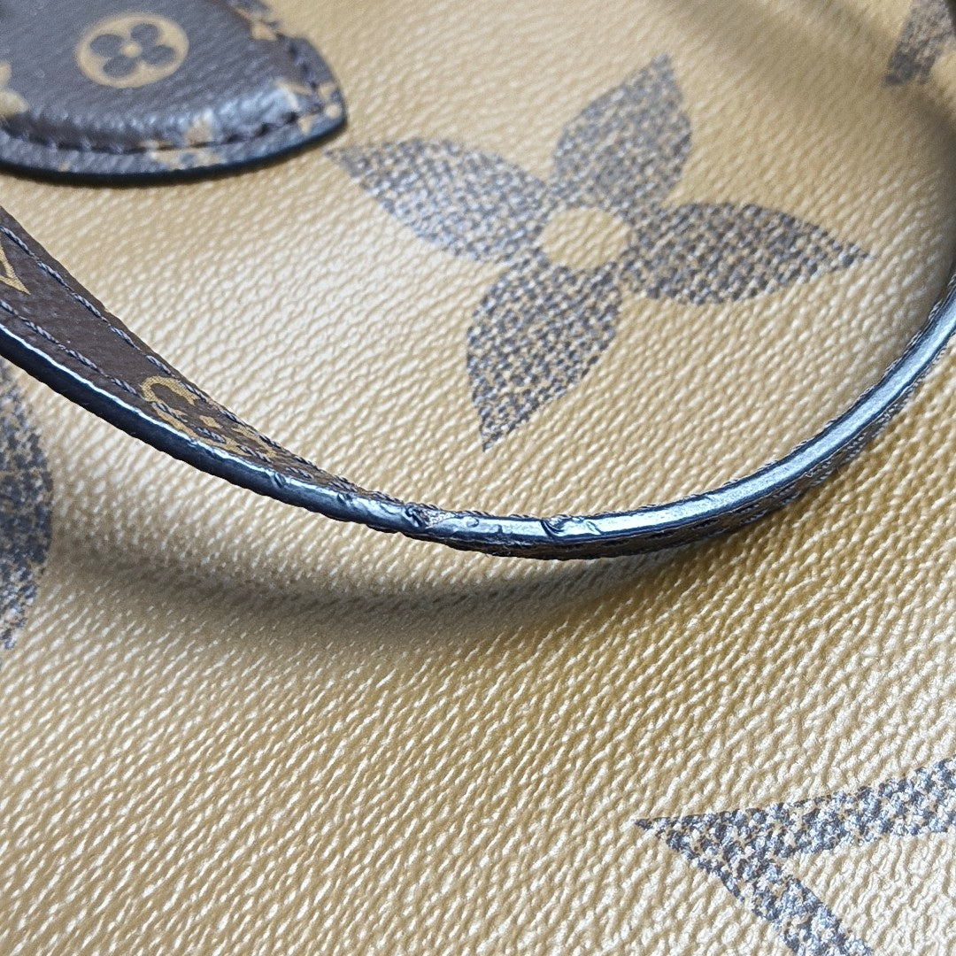 Authenticated pre-owned  Onthego GM Monogram Coated Canvas Brown - Shoulder Bag at Looply