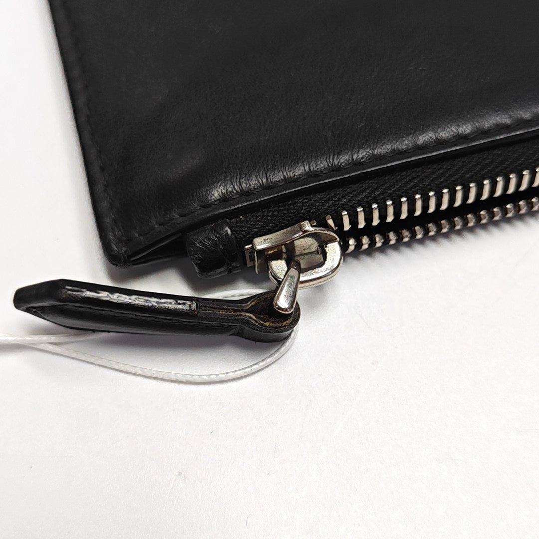 Authenticated pre-owned  Monster Calfskin Black - Clutch at Looply