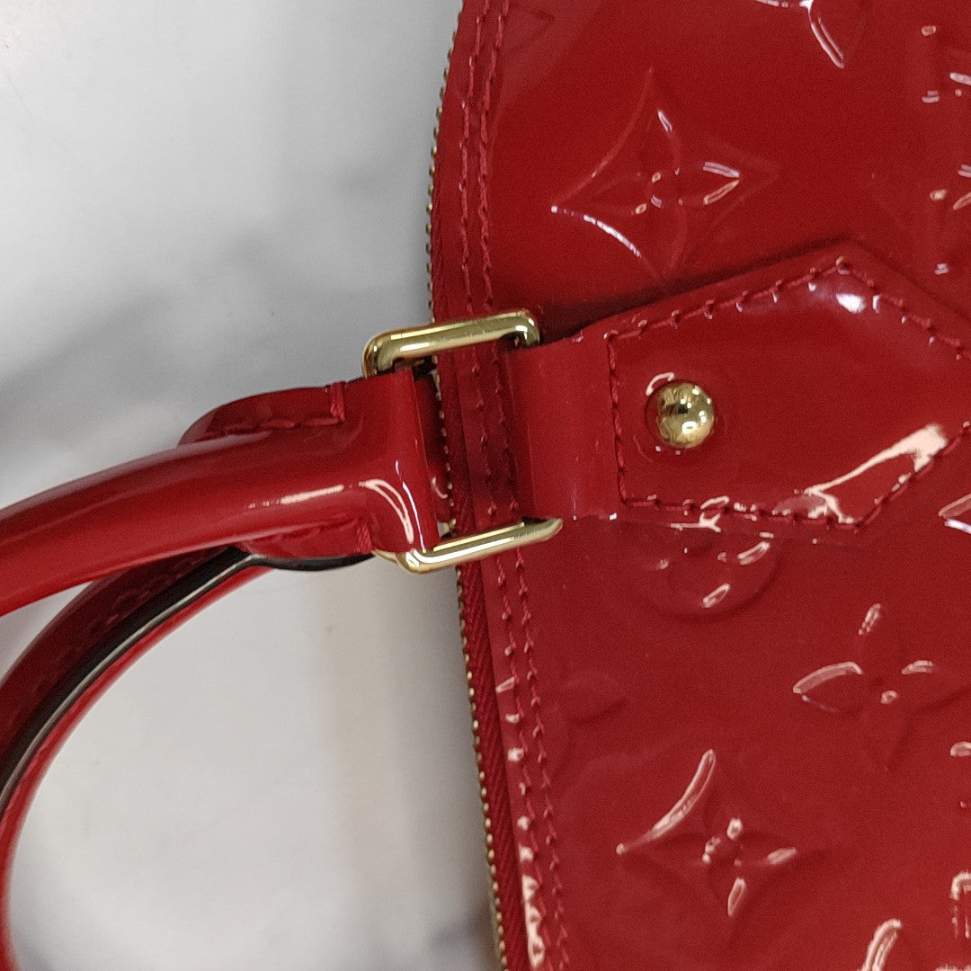 Authenticated pre-owned  Alma PM Monogram Patent Leather Red - Top Handle Bag at Looply