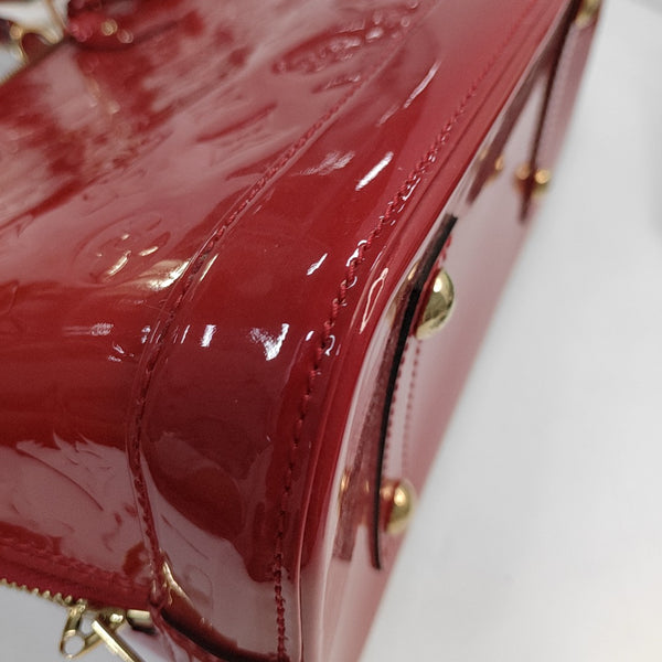Authenticated pre-owned  Alma PM Monogram Patent Leather Red - Top Handle Bag at Looply