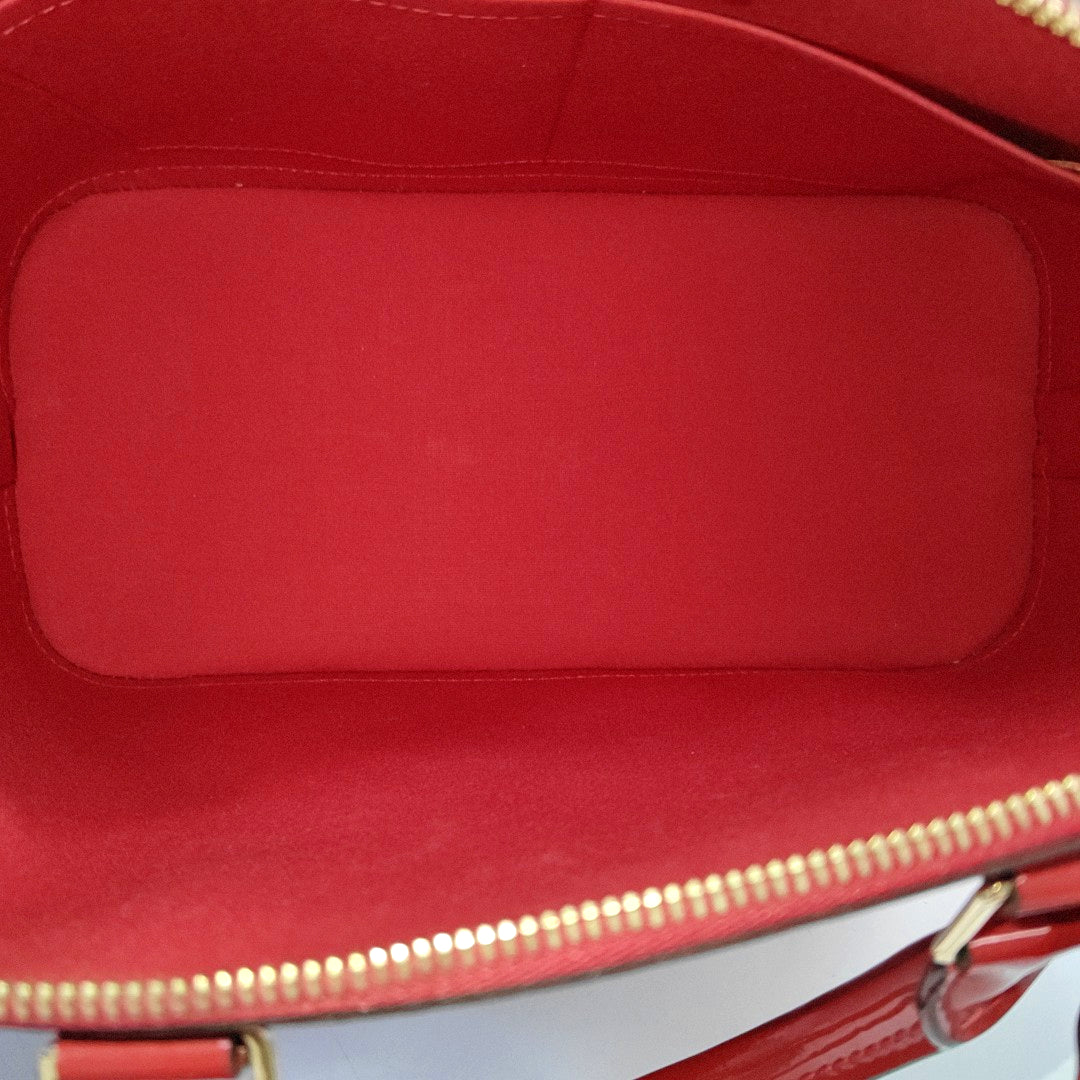 Authenticated pre-owned  Alma PM Monogram Patent Leather Red - Top Handle Bag at Looply