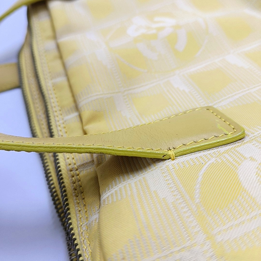 Authenticated pre-owned  Chanel Travel Line Fabric Yellow - Shoulder Bag at Looply