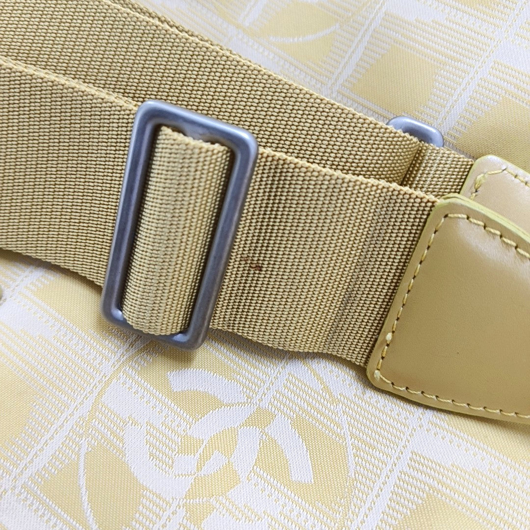 Authenticated pre-owned  Chanel Travel Line Fabric Yellow - Shoulder Bag at Looply