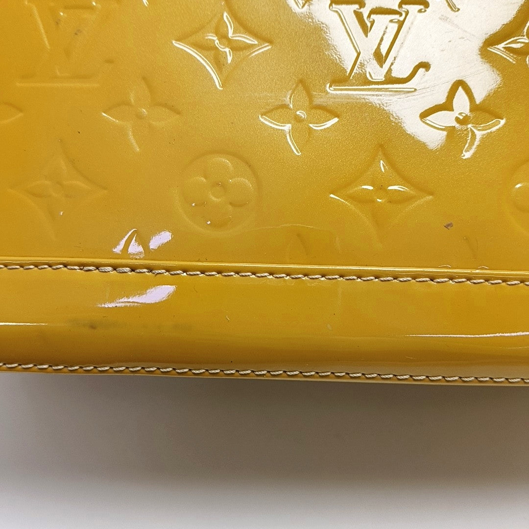 Authenticated pre-owned  Alma PM Monogram Patent Leather Yellow - Top Handle Bag at Looply