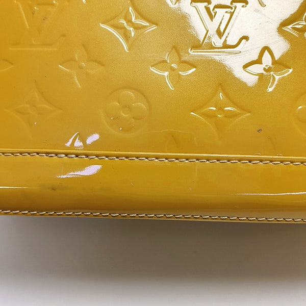 Authenticated pre-owned  Alma PM Monogram Patent Leather Yellow - Top Handle Bag at Looply