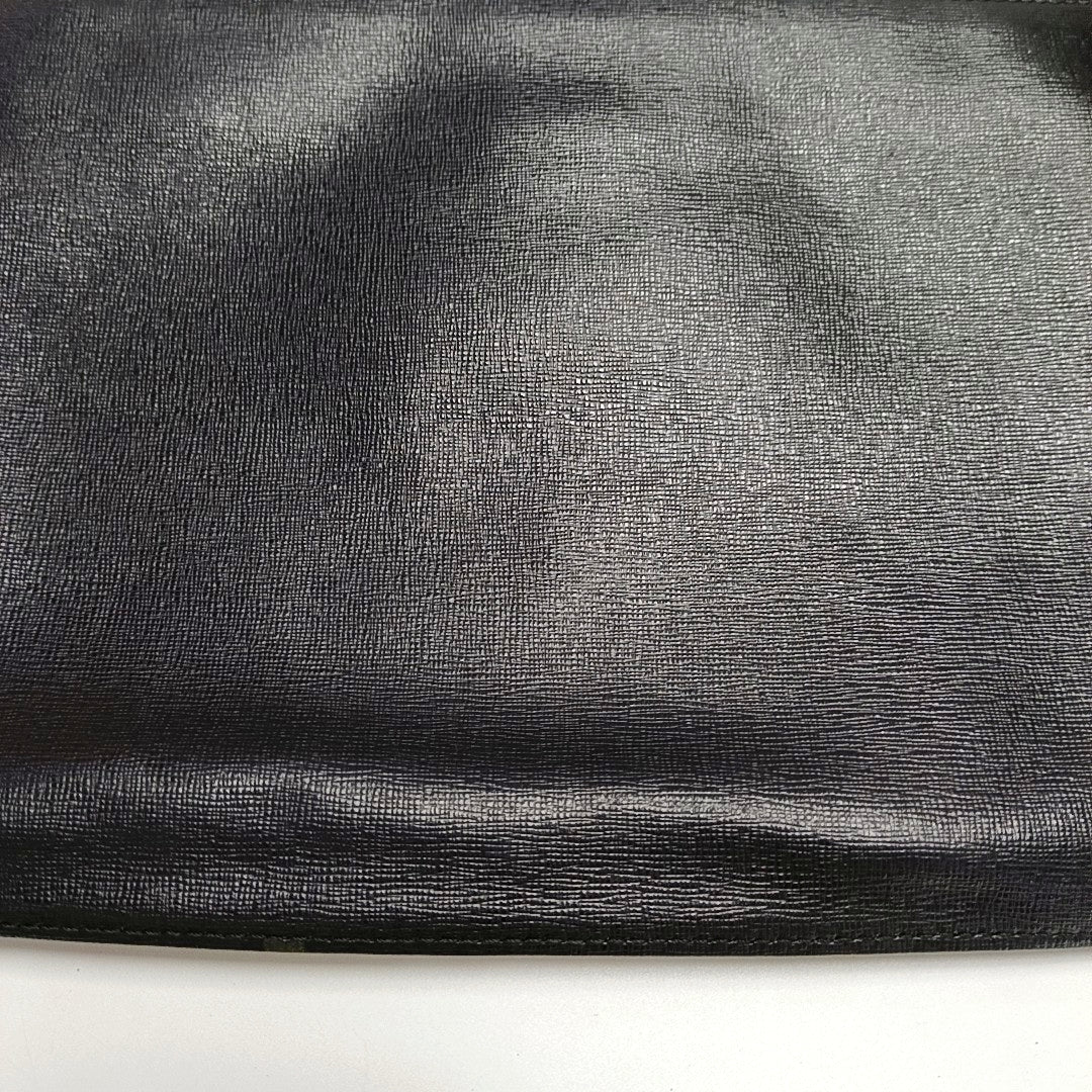 Authenticated pre-owned  Karlito Calfskin Black - Clutch at Looply