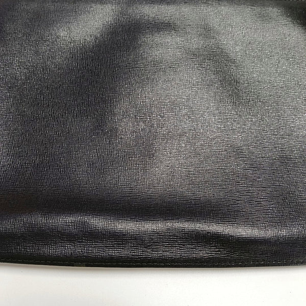 Authenticated pre-owned  Karlito Calfskin Black - Clutch at Looply