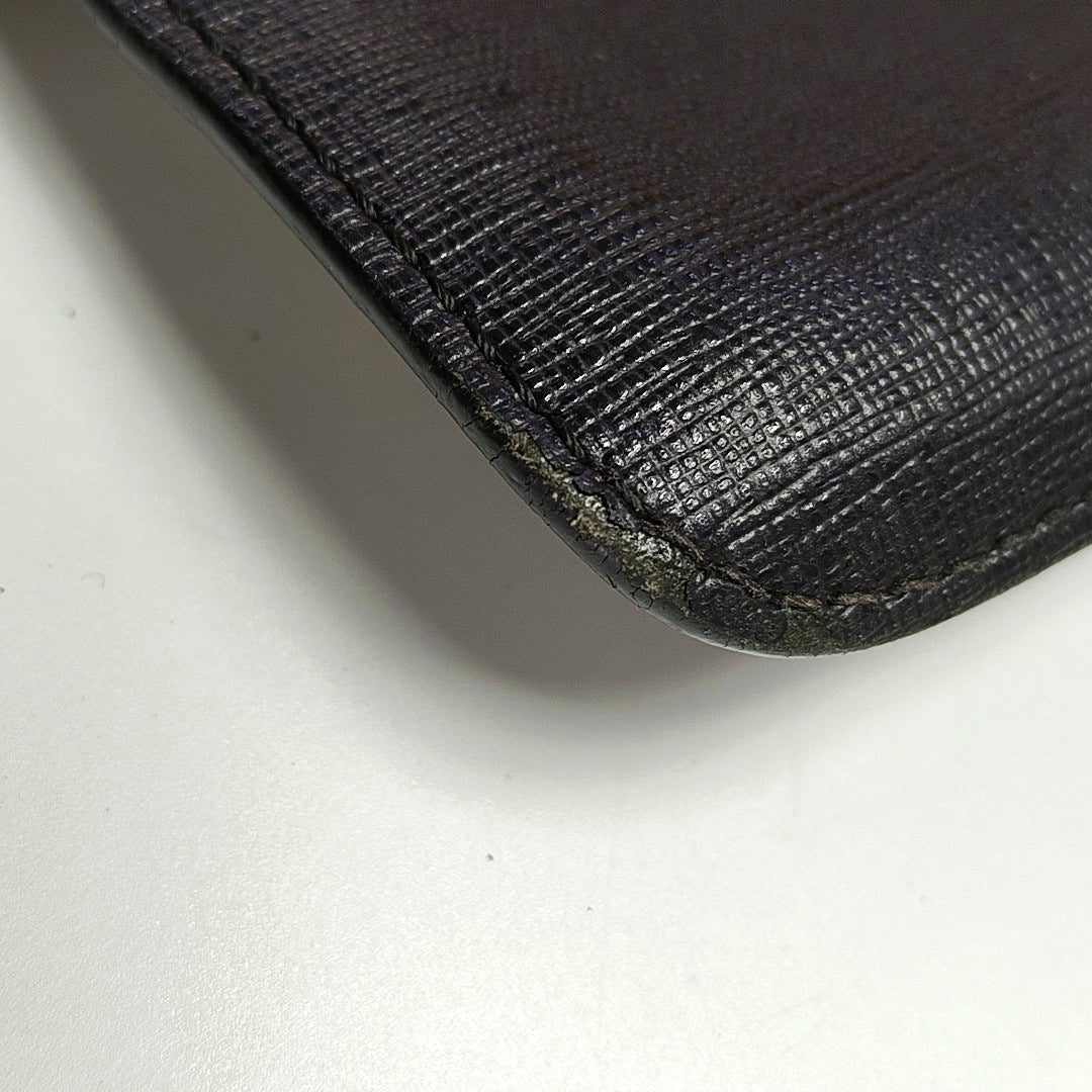 Authenticated pre-owned  Karlito Calfskin Black - Clutch at Looply