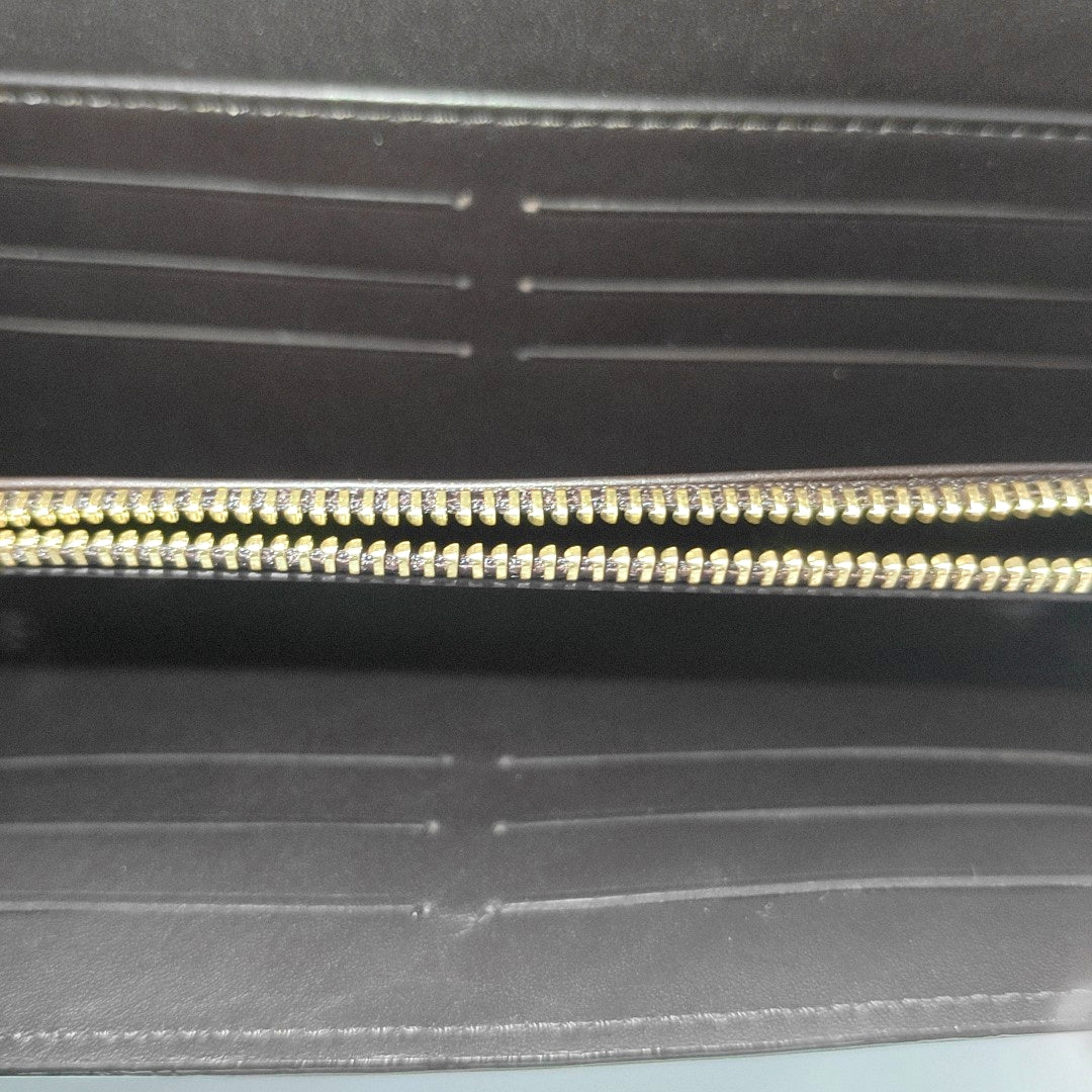 Authenticated pre-owned  LV × TM Sarah Patent Leather Burgundy - Clutch at Looply