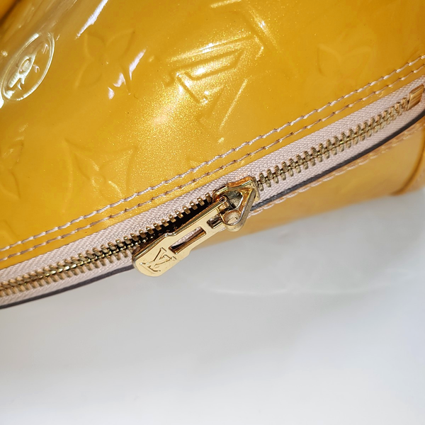 Authenticated pre-owned  Alma PM Patent Leather Yellow - Top Handle Bag at Looply