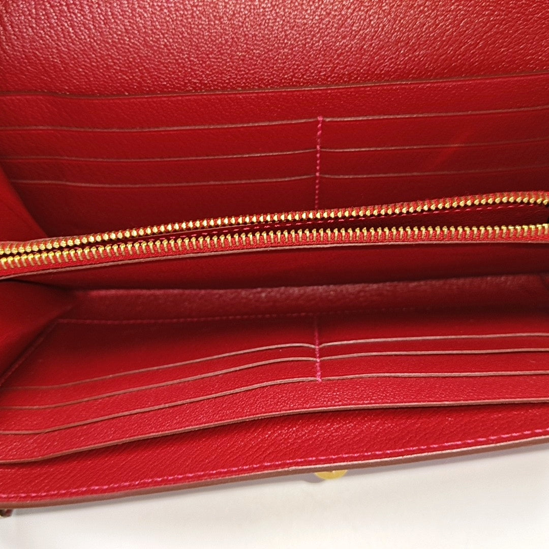 Authenticated pre-owned  Kelly Ostrich Red Wallet - Wallet at Looply