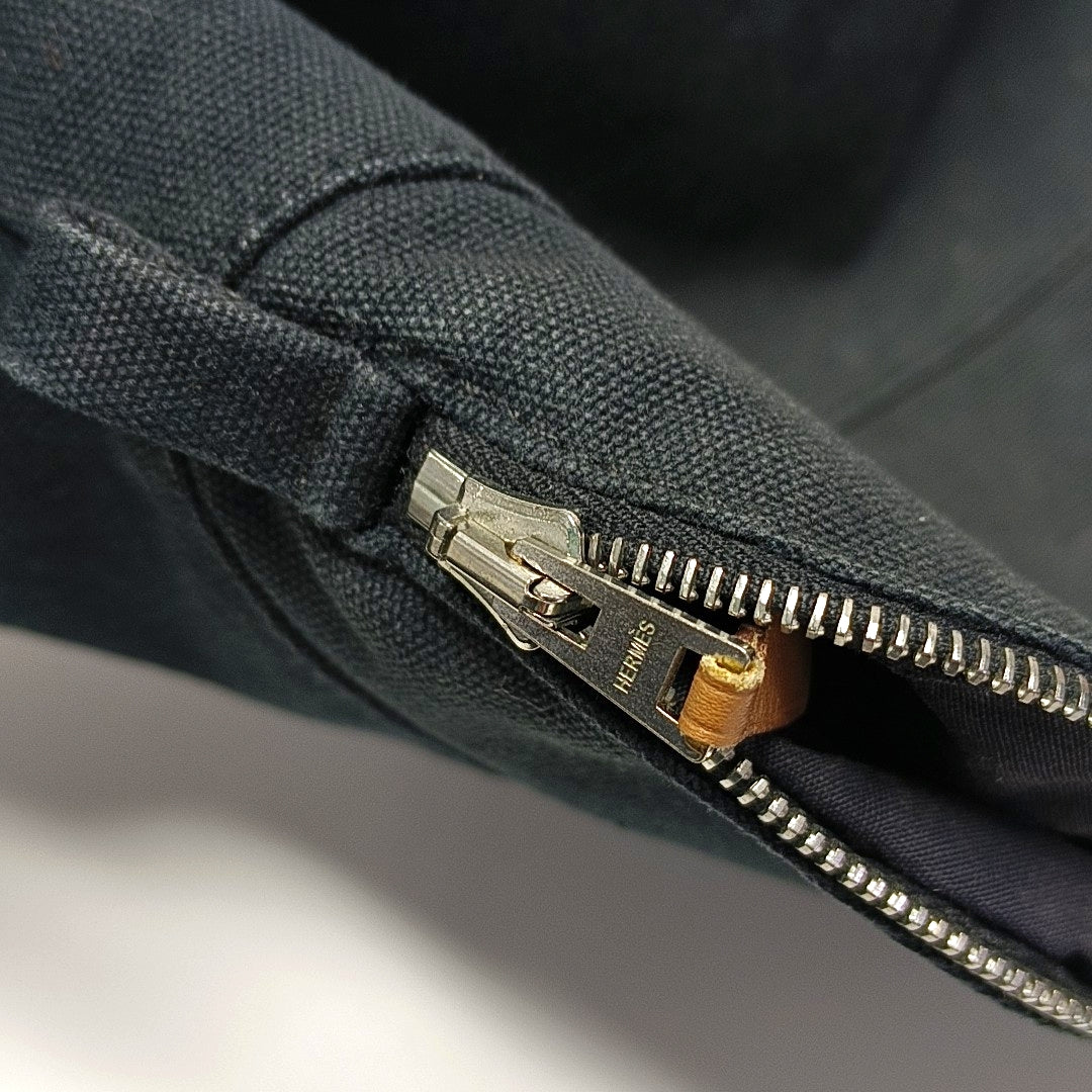 Authenticated pre-owned  Bolide Canvas Black - Clutch at Looply
