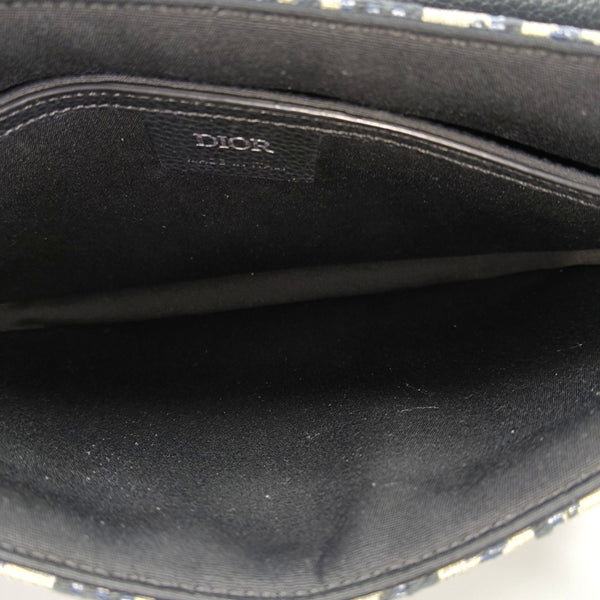 Authenticated pre-owned  Saddle Oblique Canvas Beige - Clutch at Looply