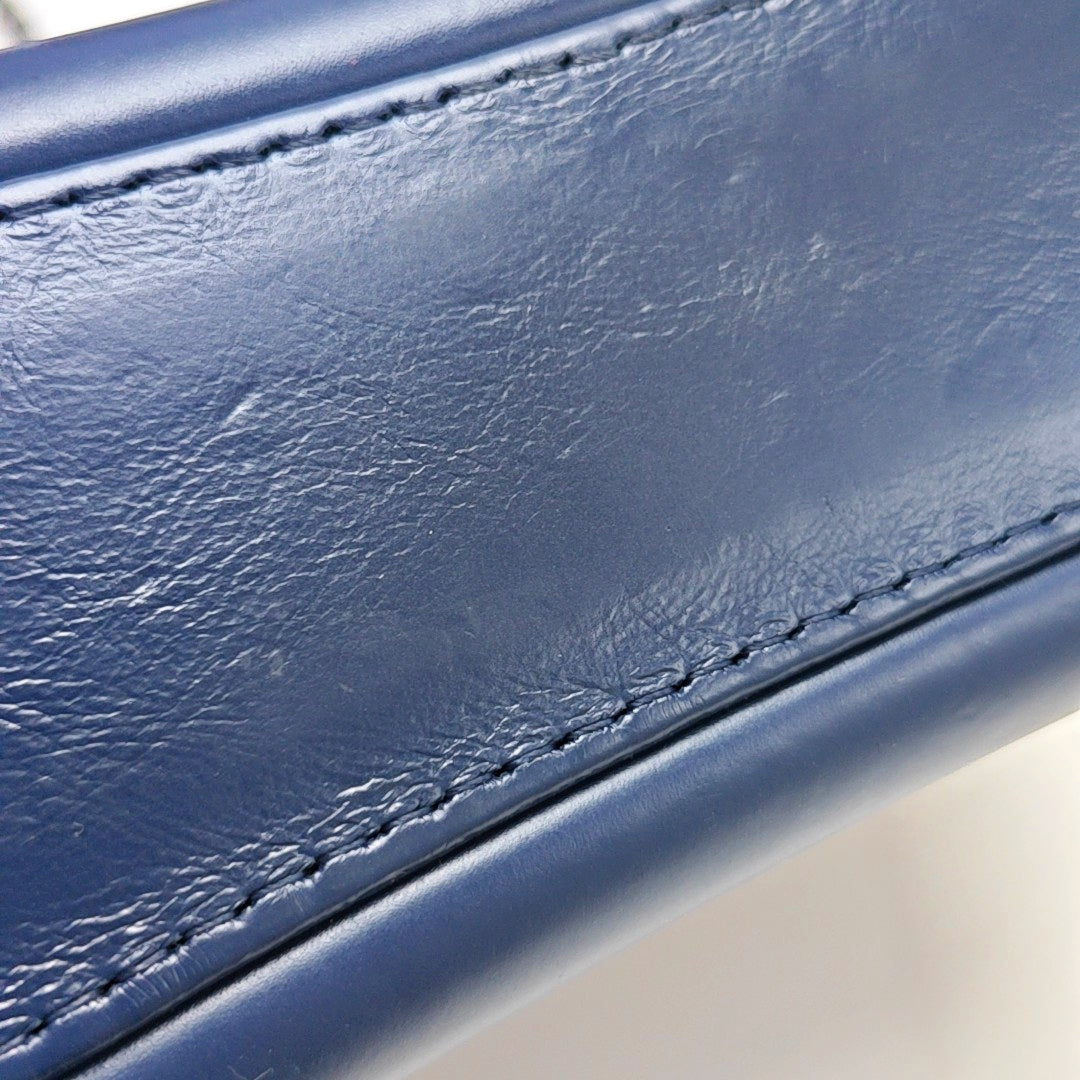 Authenticated pre-owned  Gabrielle Small Quilted Calfskin Blue - Clutch at Looply