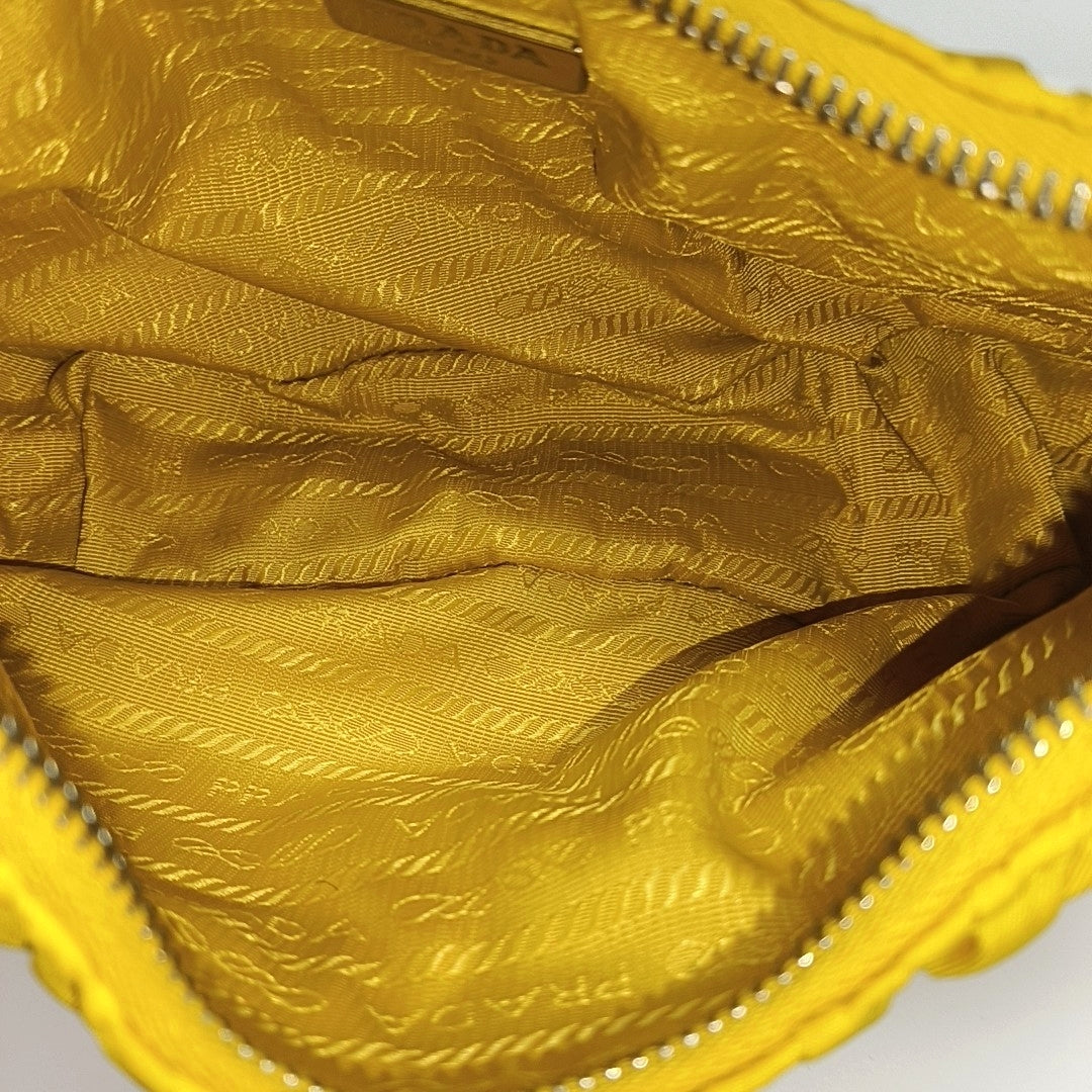 Authenticated pre-owned  Re-edition2005 Mini Nylon Yellow - Top Handle Bag at Looply