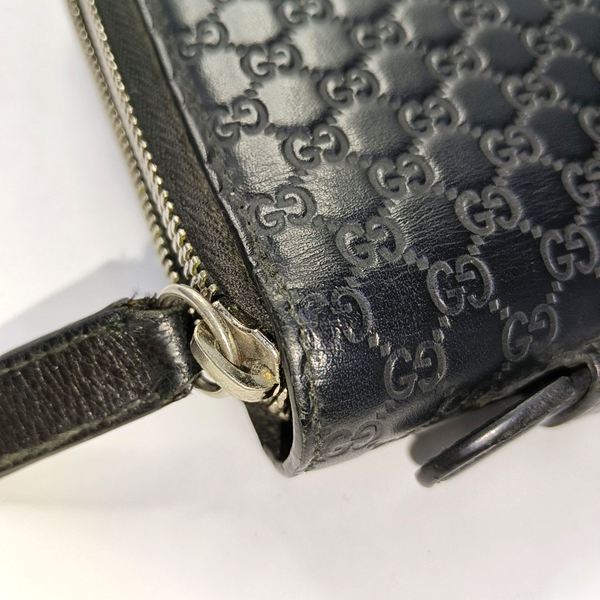 Authenticated pre-owned  Microguccissima Monogram Calfskin Black - Clutch at Looply