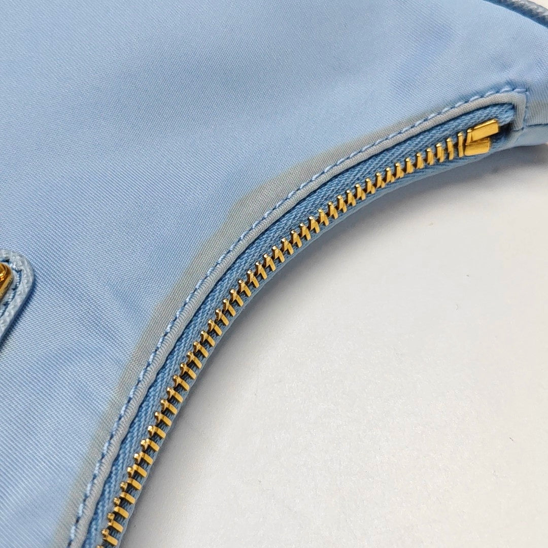 Authenticated pre-owned  Re-edition2005 Mini Nylon Blue - Top Handle Bag at Looply