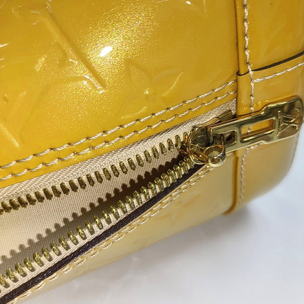 Authenticated pre-owned  Alma PM Monogram Patent Leather Yellow - Top Handle Bag at Looply