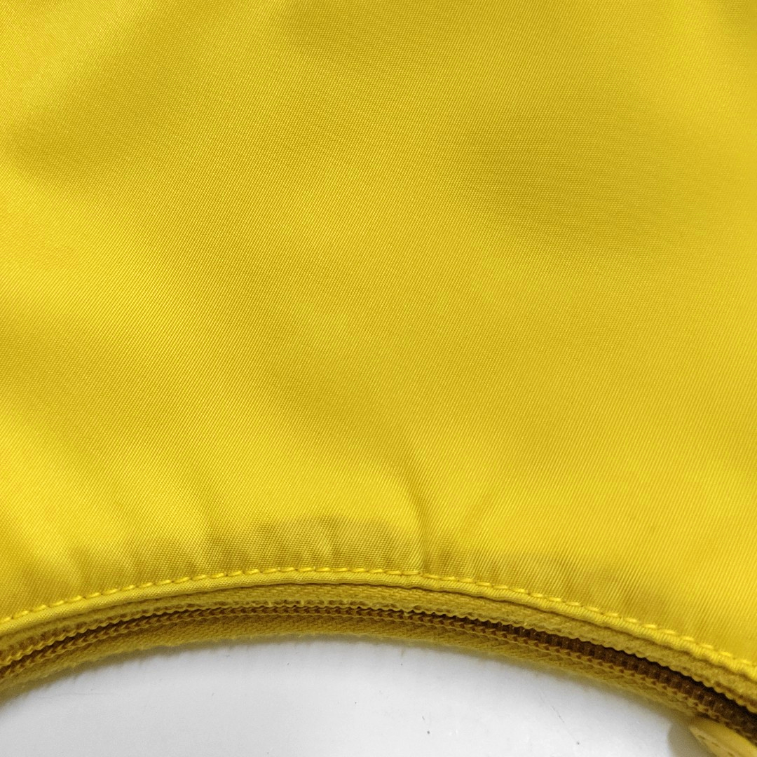 Authenticated pre-owned  Re-Edition2000 Mini Nylon Yellow - Top Handle Bag at Looply