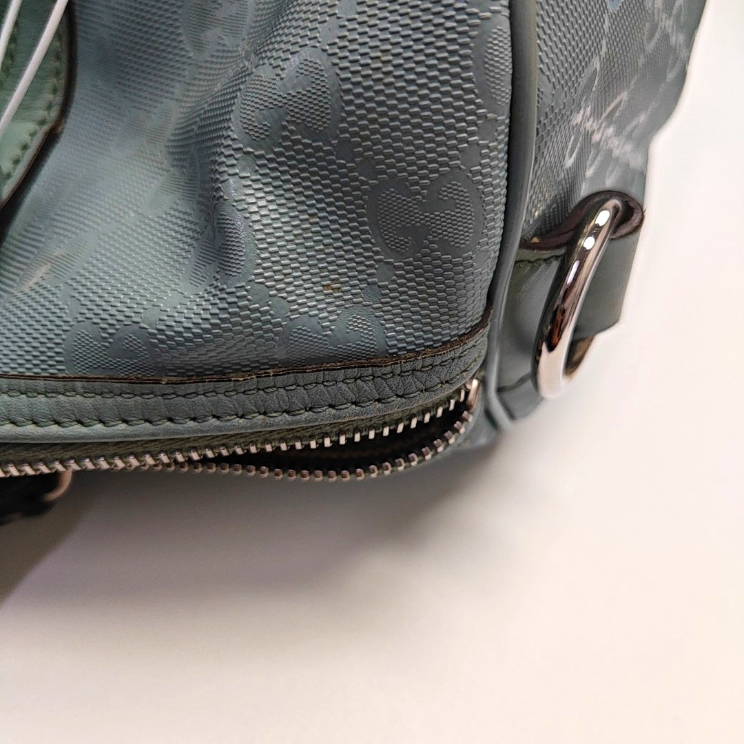Authenticated pre-owned  Joy Medium Monogram Coated Canvas Blue - Top Handle Bag at Looply