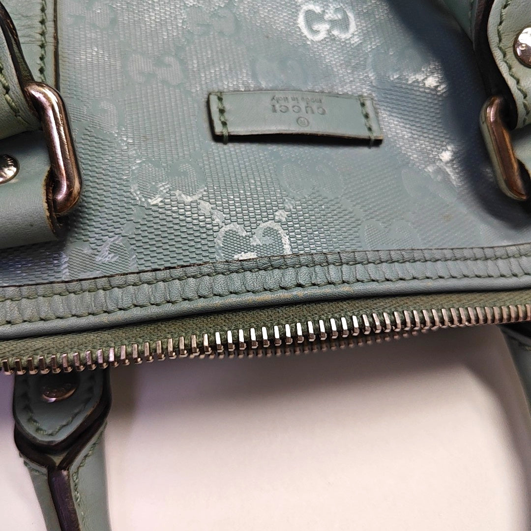 Authenticated pre-owned  Joy Medium Monogram Coated Canvas Blue - Top Handle Bag at Looply