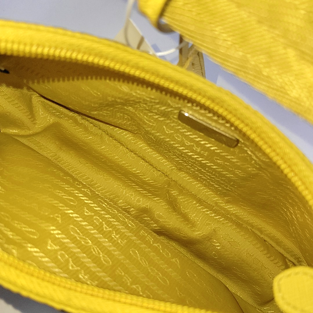 Authenticated pre-owned  Re-Edition2000 Mini Nylon Yellow - Top Handle Bag at Looply